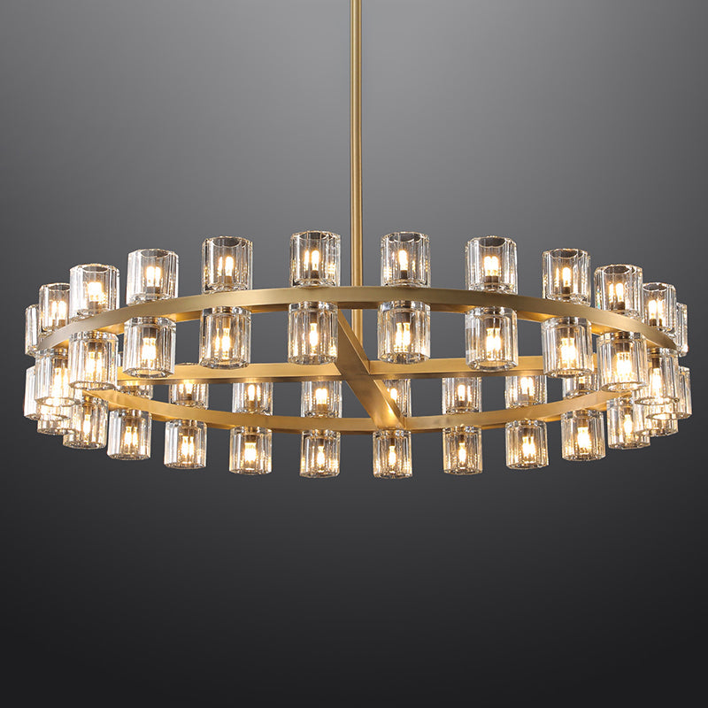 The rhythmic design of this chandelier collection is inspired by the shape and scale of industrial gears, where spokes are interlaced with negative space to interlock with other gears. Here, the spokes are hexagonal in form, juxtaposed with a circular interior, crafted from crystal glass, running along a simple, sturdy metal frame. The light shines through the glass as if it were a candle.