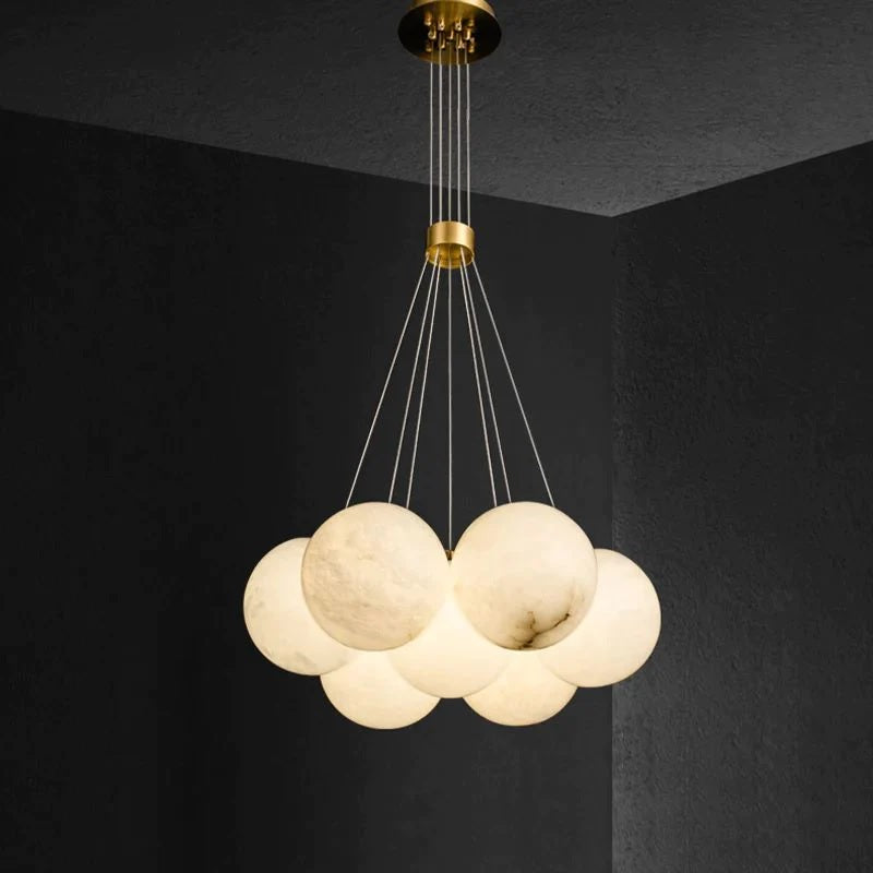 The Alabaster Chandelier is not only a functional lighting fixture, but also a work of art that elevates the aesthetic appeal of your space. Its unique combination of galactic appearance, pearl-like alabaster shade, and customizable quantity make it a truly extraordinary piece that adds a touch of grandeur and luxury to any interior design.
