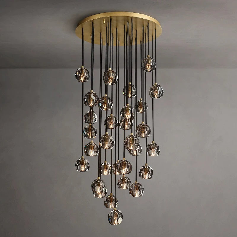 The hexagonal and pentagonal facets on the surface of the K9 glass spheres allow the warm light to reflect beautifully, creating a stunning and inviting ambiance. The overall design of the chandelier highlights its elegance and sophistication, making it a perfect addition to any room that needs a touch of glamour.