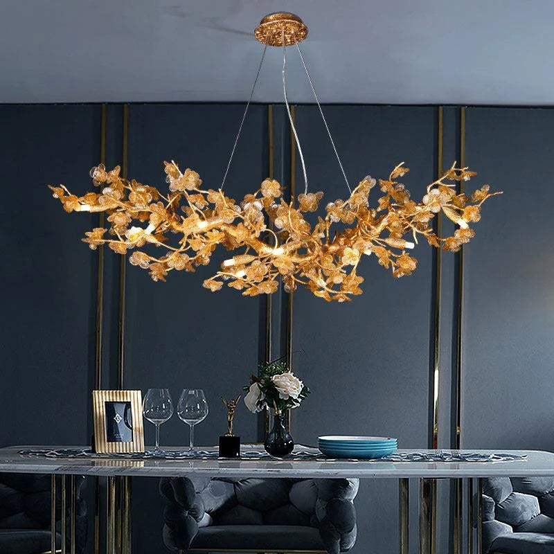 Rita Chandelier is made of Brass and High-quality glass. The small glass pieces are formed to be the flower shape. Body frame is hand-forged into beautifully intricate tree branches.  Suitable for every space in your room.
