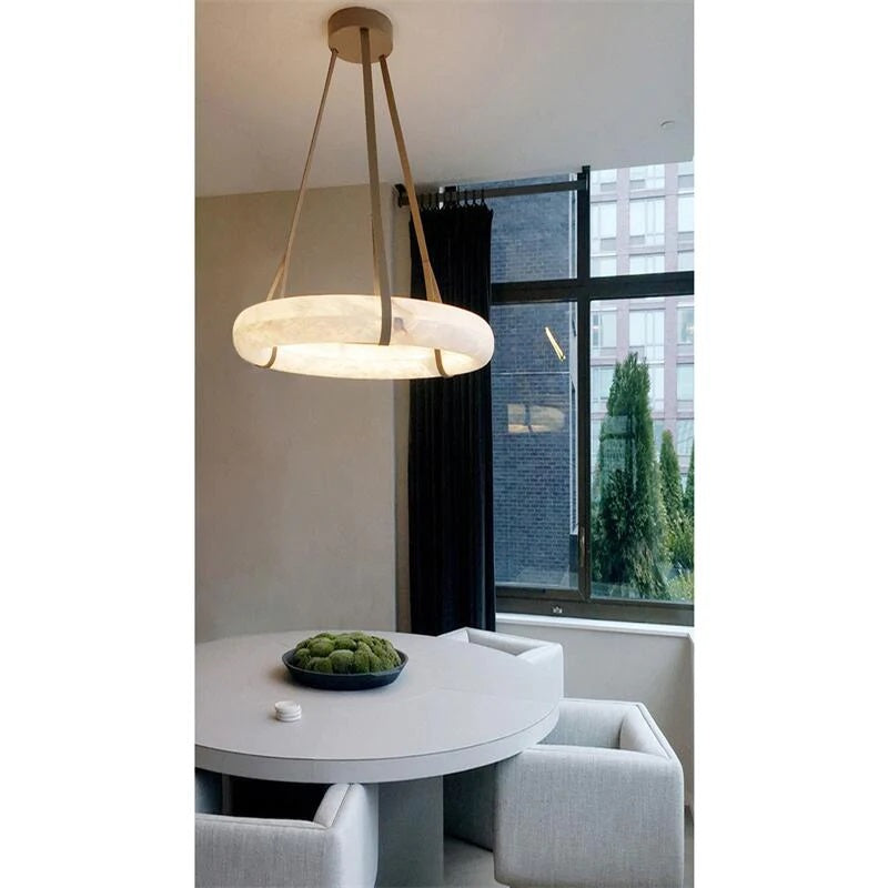 Alone or in a composition, OSLO pendant light shines like luminous halos. The flexibility of OSLO L’s leather hooks underlines its lightness while stabilizing it. The three straps hang on a single central pavillion. The color of the leather is chosen among various shades to personalize this pendant light.