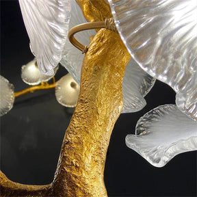 This modern Leaf Glass Flower Linear Chandelier is made of brass and glass. The glass are scattered on the branches, the surface treatment of the branches are also inspired by the tree stem. It's perfect for home decoration. 