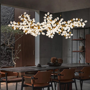 The frame of the branches is handmade and the cups are made of balls in the shape of grapes in milk white and gold. It is an elegant and charming lamp for banquets, living room foyers.
