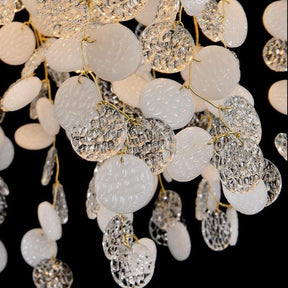 Wisam Creative Oval Tree Branch Chandelier a luxurious chandelier made of brass and glass discs. Inspired by organic nature, this chandelier is suitable for use in the living room or dining room. It is an elegant, attractive and looks like a blossoming tree, making the home fresh and delightful like nature.