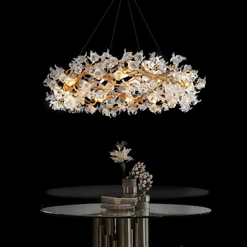 The brass lamp body exudes a sense of elegance and sophistication, with its lustrous finish adding a touch of opulence to any space. The delicate petal shaped crystals are intricately arranged, creating a mesmerizing visual display when illuminated. The combination of lighting design and natural elements in the form of crystals is a perfect harmony, bringing a sense of wonder and beauty to the chandelier.