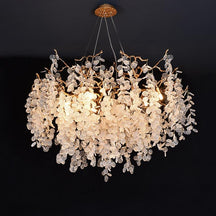 Wisam Branch Chandelier a luxurious chandelier made of brass and glass discs. Inspired by organic nature, this chandelier is suitable for use in the living room or dining room. It is an elegant, attractive and looks like a blossoming tree, making the home fresh and delightful like nature.