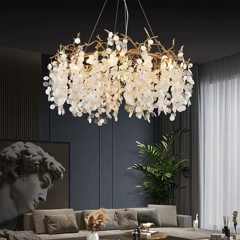 Wisam Round Ring Branch Chandelier a luxurious chandelier made of brass and glass discs. Inspired by organic nature, this chandelier is suitable for use in the living room or dining room. It is an elegant, attractive and looks like a blossoming tree, making the home fresh and delightful like nature.