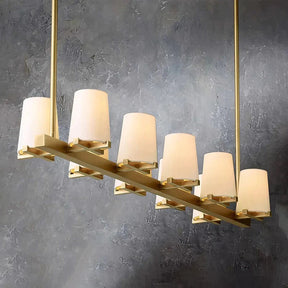 Sean Chandelier Collection use of solid brass for the X-shaped base provides a sturdy foundation for the chandelier, while the tapered shade adds a delicate touch. The White Fabric Lampshade not only serves a functional purpose in refracting light, but also adds an elegant touch by creating a shimmering effect similar to that of a candle. 